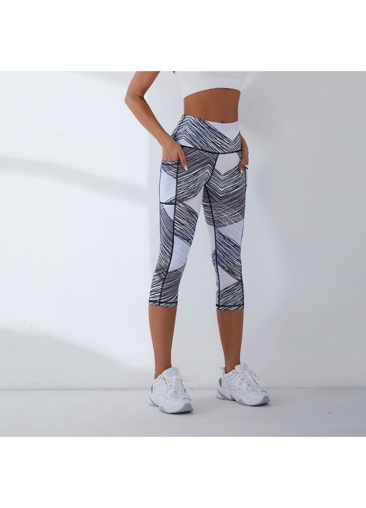 2021 European and American new yoga pants women's cross border slim high waist fitness pants running sports pants two side pocket Capris