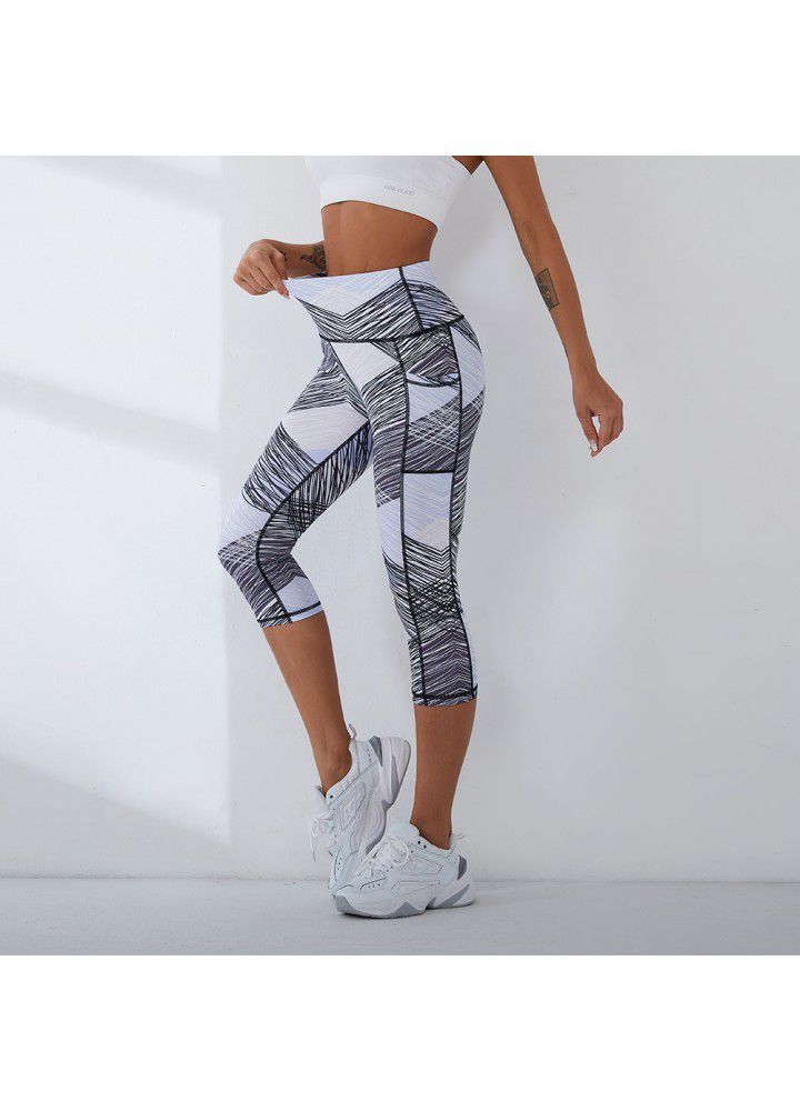 2021 European and American new yoga pants women's cross border slim high waist fitness pants running sports pants two side pocket Capris