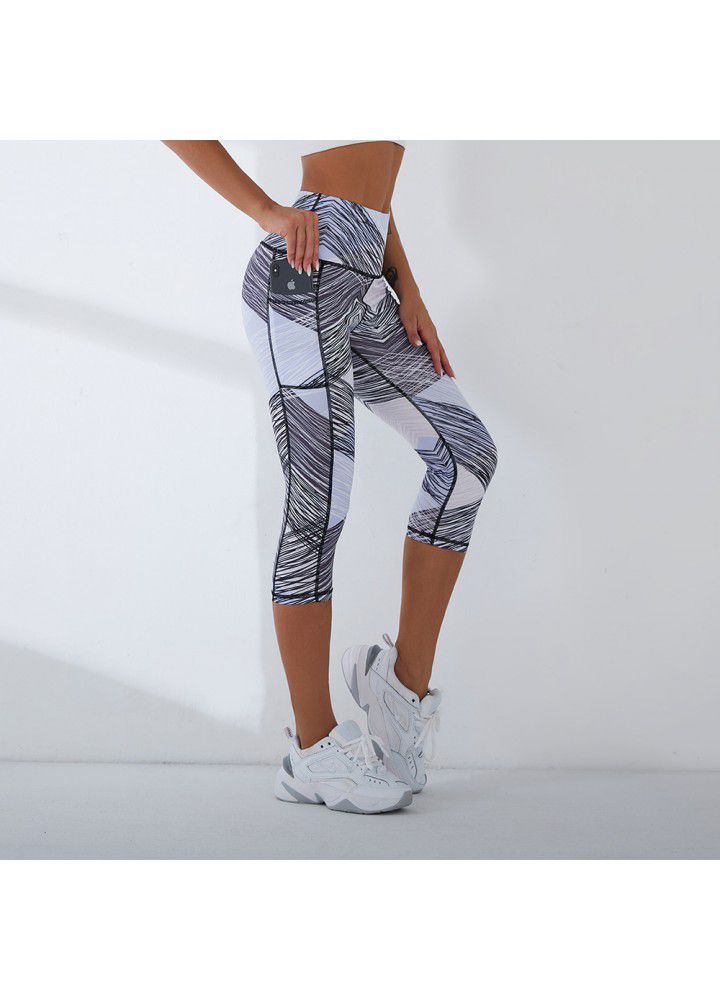 2021 European and American new yoga pants women's cross border slim high waist fitness pants running sports pants two side pocket Capris