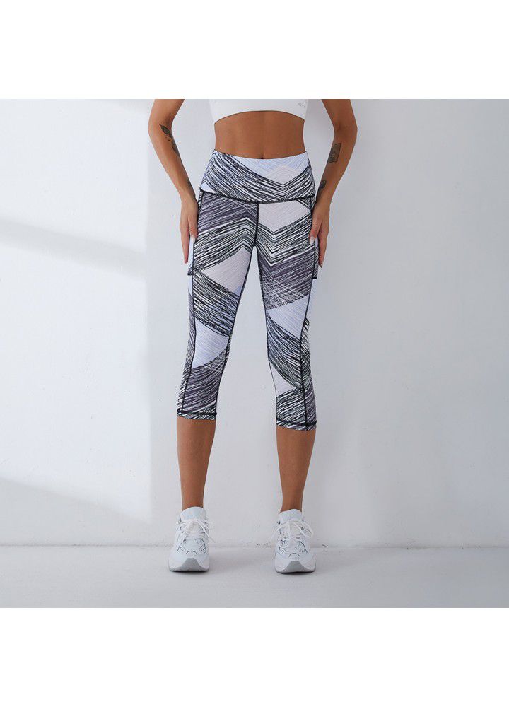2021 European and American new yoga pants women's cross border slim high waist fitness pants running sports pants two side pocket Capris